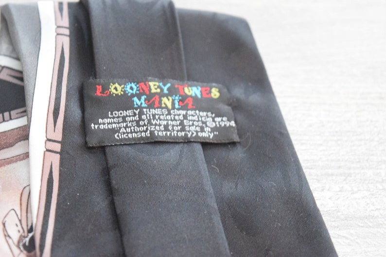 Looney Tunes Mania Black Necktie features Bugs Bunny Daffy Duck Tasmanian Devil in Comic Book Gangster Style