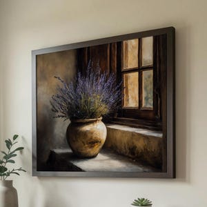 May include: A framed painting depicts a still life of a vase of lavender by a window. The vase is a light brown color and the lavender is purple. The window frame is dark brown. The painting is displayed above a dark brown table.