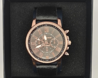 Elegante reloj unisex de cuarzo informal con esfera con números romanos.