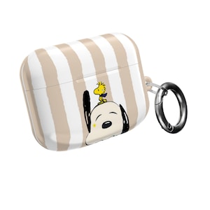 May include: An AirPods case with a white and beige striped pattern, featuring a Snoopy and Woodstock cartoon design. It has a silver carabiner clip. A fun and playful accessory.