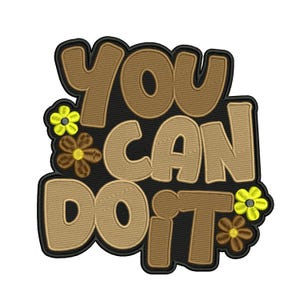 May include: Embroidered patch with the words "YOU CAN DO IT" in brown bubble letters on a black background. Two yellow and brown embroidered flowers are on the left and right sides of the text. The patch has a black border.