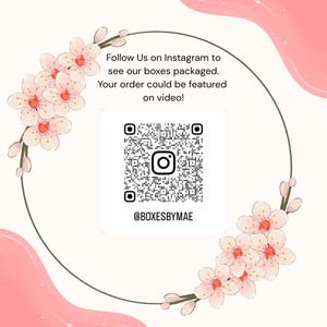 May include: A graphic with a QR code and Instagram handle @BOXESBYMAE, surrounded by a floral design. Text reads "Follow Us on Instagram to see our boxes packaged. Your order could be featured on video!"