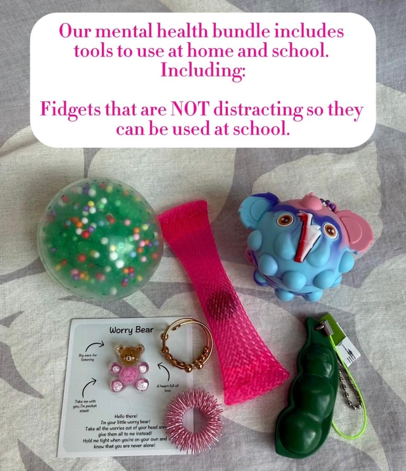 May include: A collection of fidget toys, including a green ball with colorful beads, a pink mesh tube, a blue elephant-shaped toy, a Worry Bear card, a gold ring, a pink spiky ring, and a green pea pod. Text on the image reads: "Our mental health bundle includes tools to use at home and school."