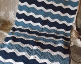 Crocheted small afghan, blue white chevron design