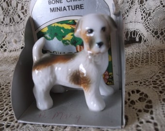 Miniature bone china dog figurine