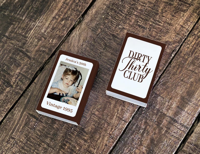 May include: Two brown rectangular boxes are displayed on a wooden surface. One box features a photo of a young child with the text "Jessica's 30th" and "Vintage 1995." The other box has the words "Dirty Thirty Club."