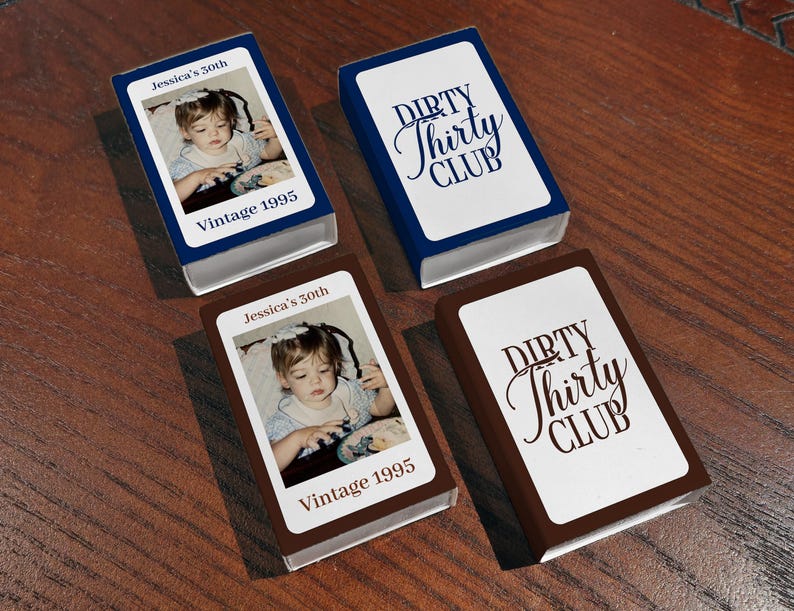 May include: Four small, rectangular boxes. Two boxes are navy blue with white text that reads "DIRTY Thirty CLUB". The other two boxes are brown with a photo of a child and the text "Jessica's 30th" and "Vintage 1995".