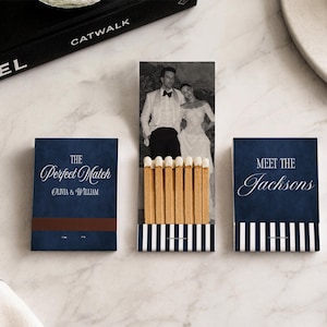 May include: Three matchbooks with navy blue covers. One closed matchbook reads The Perfect Match Olivia & William. Another closed matchbook reads Meet The Jacksons. The center open matchbook displays a black and white photo of a couple.