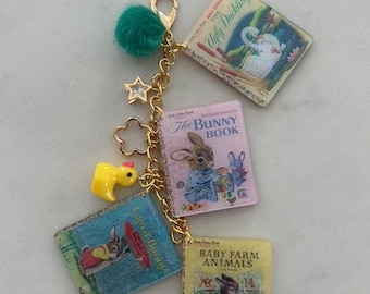 Book, reading lovers, and homebody themed bag or purse charm.