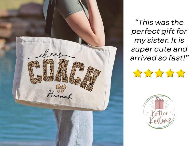 May include: Cream-colored tote bag with the words "cheer COACH" in black and leopard print. The name "Hannah" is printed below the text. A bow graphic is between the words "COACH" and "Hannah".