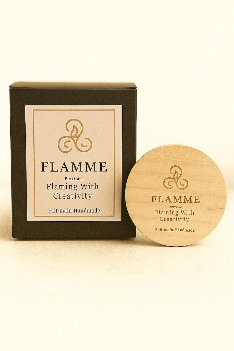 a black box and a wooden coaster with the word "FLAMME" printed on them.