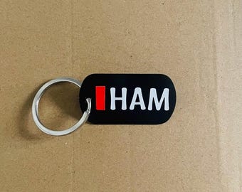 Chaveiro com tema de F1 da Ferrari de Lewis Hamilton