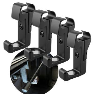May include: Four black metal car seat hooks. Each hook has a curved top and bottom, with a screw and a circular opening. The hooks are designed to attach to a car seat.