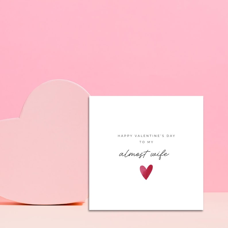 Minimalist greeting card printed on white 300gsm cardstock with text saying 'Happy Valentine's Day to My Almost Husband/Wife'.
Simple romantic design with multiple variations, with white envelope.