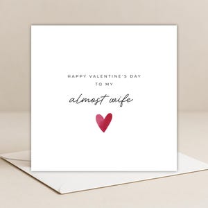 Minimalist greeting card printed on white 300gsm cardstock with text saying 'Happy Valentine's Day to My Almost Husband/Wife'.
Simple romantic design with multiple variations, with white envelope.