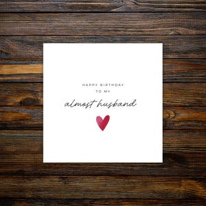 Minimalist greeting card printed on white 300gsm cardstock with text saying 'Happy Valentine's Day to My Almost Husband/Wife'.
Simple romantic design with multiple variations, with white envelope.