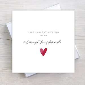 Minimalist greeting card printed on white 300gsm cardstock with text saying 'Happy Valentine's Day to My Almost Husband/Wife'.
Simple romantic design with multiple variations, with white envelope.