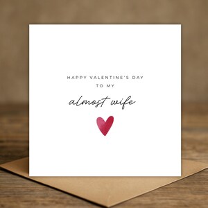 Minimalist greeting card printed on white 300gsm cardstock with text saying 'Happy Valentine's Day to My Almost Husband/Wife'.
Simple romantic design with multiple variations, with white envelope.