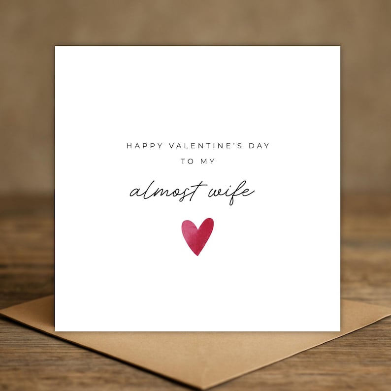 Minimalist greeting card printed on white 300gsm cardstock with text saying 'Happy Valentine's Day to My Almost Husband/Wife'.
Simple romantic design with multiple variations, with white envelope.