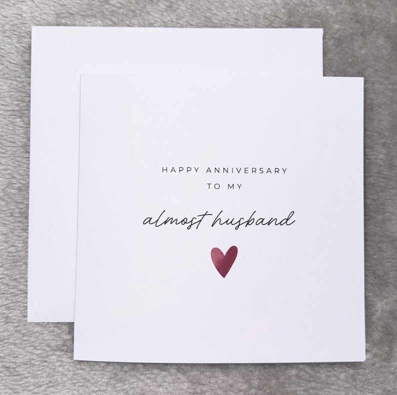 Minimalist greeting card printed on white 300gsm cardstock with text saying 'Happy Valentine's Day to My Almost Husband/Wife'. Simple romantic design with multiple variations, with white envelope.