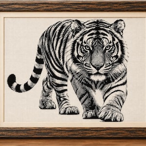 May include: A framed cross-stitch embroidery featuring a detailed black and white tiger walking forward. The tiger is depicted with sharp, contrasting stripes against a light-colored fabric background, enclosed in a dark, textured wooden frame.