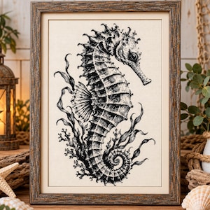 May include: A framed cross-stitch artwork featuring a detailed black and white illustration of a seahorse surrounded by seaweed and coral. The piece is encased in a dark, weathered wooden frame with a light-colored mat, showcasing intricate needlework.
