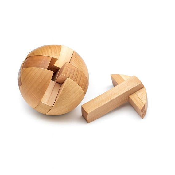 A hand-assembled interlocking wooden sphere puzzle that doubles as a beautiful desk object — a brain teaser you'll want to display even when solved.