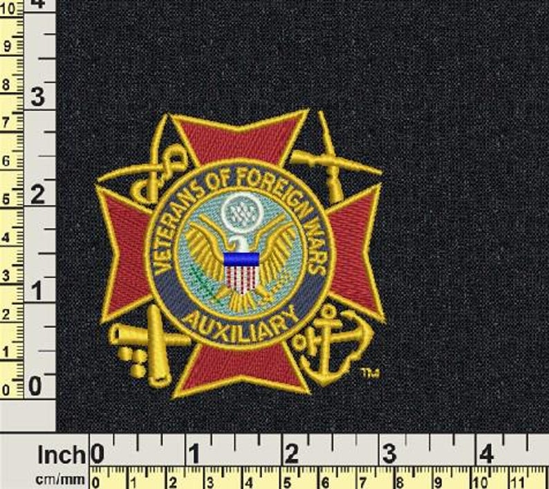 May include: Embroidered patch with the text "Veterans of Foreign Wars Auxiliary" encircling a central emblem. The emblem features an eagle, a shield, and a blue stripe. The patch is red, gold, blue, and white on a black background.