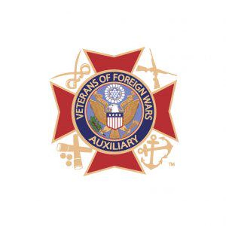 May include: A red and gold emblem with a central circular design featuring an eagle and shield, surrounded by the text "VETERANS OF FOREIGN WARS AUXILIARY." The emblem is set against a white background, with gold and red star-shaped elements.