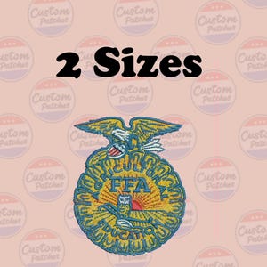 May include: Embroidered FFA emblem patch in shades of yellow, blue, and red, featuring an eagle, the letters "FFA", and the words "Agriculture Education". The text "2 Sizes" is above the emblem on a peach background.