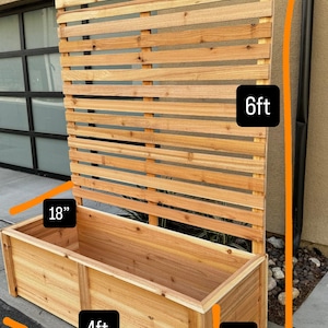 May include: A wooden planter box with a slatted trellis. The planter box is 4 feet long, 18 inches wide, and 18 inches tall. The trellis is 6 feet tall. The wood has a natural finish.