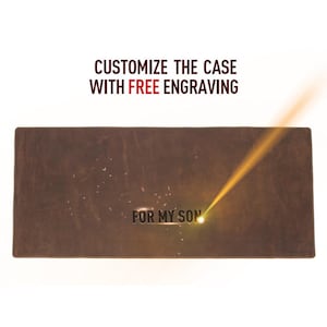 May include: A rectangular, brown leather case with the text "FOR MY SON" engraved on it. The image also includes the text "CUSTOMIZE THE CASE WITH FREE ENGRAVING". A bright yellow laser beam is focused on the case.