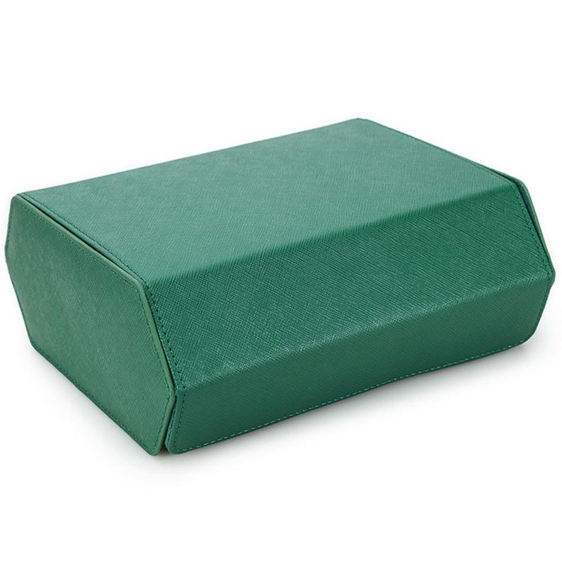 May include: A rectangular, emerald green box with a textured surface. The box has angled sides and a flat top, suggesting a storage container. The stitching is visible along the edges, indicating a well-crafted design.