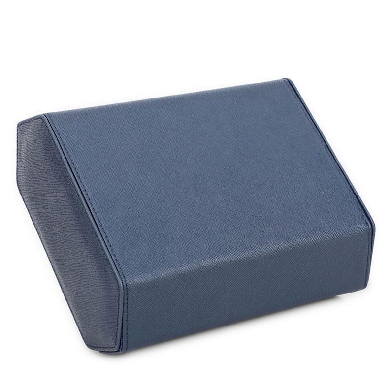 May include: A rectangular, blue box with a textured surface. The box has rounded corners and a stitched seam along the edges. The color is a muted, medium blue.