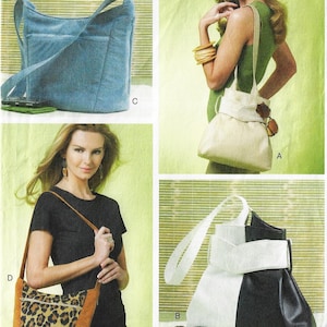 May include: Four different styles of handbags. The first is a white handbag with a brown strap. The second is a black and white handbag with a white strap. The third is a blue denim handbag with a brown strap. The fourth is a brown and leopard print handbag with a brown strap.