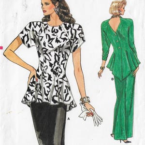 May include: A sewing pattern for a two-piece outfit. The top is a white and black patterned blouse with a peplum and short sleeves. The bottom is a black skirt. The pattern also includes a green jacket with a peplum and long sleeves. The pattern is labelled "A" and "B".