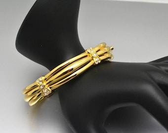 Sparkling Nolan Miller Clamper Bracelet Gold Plated with Rhinestone Bows Oval Shape