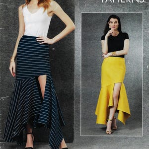 May include: Image of two women modeling skirts. One skirt is navy blue with white stripes and a high slit. The other skirt is yellow with a high slit. Both skirts have a unique design. The models are wearing tops and heels.