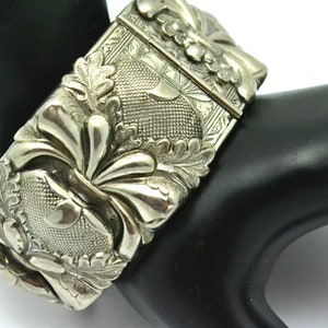 1960s Wide Hinged Bangle Bracelet with Repousse Design Silver Tone Metal Art Nouveau Design