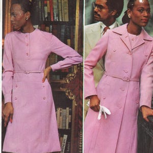 May include: Two women wearing pink outfits. One is wearing a long-sleeved dress with a belt, and the other is wearing a long coat with a belt. Both outfits are button-down and have a vintage style.