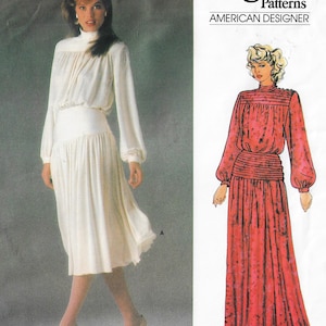 May include: A sewing pattern for a dress with a high neck and long sleeves. The pattern is from Vogue Patterns, American Designer. The dress is shown in two versions: one in white and one in red.