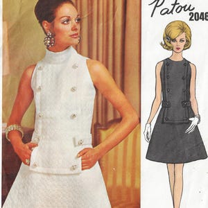 May include: A vintage sewing pattern for a sleeveless dress with a high collar and button detailing. The pattern is by Patou and the number is 2046.