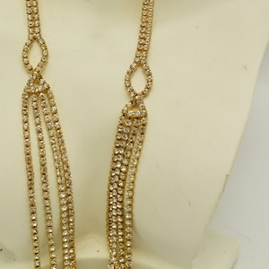 Sparkling Rhinestone Necklace with 4 Strand Detail Gold Tone Metal