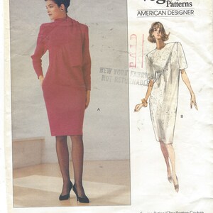 May include: A sewing pattern for a dress with a high neckline and a fitted silhouette. The pattern is from Vogue Patterns, American Designer, and is labeled "EASY/FACILE". The pattern number is 2336.