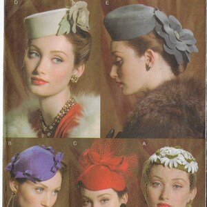 May include: Vogue Accessories pattern featuring five vintage hats. The hats include a light green pillbox hat with a floral accent, a gray hat with a large flower, a purple hat with bows, a red hat with a bow and veil, and a white hat with daisies.