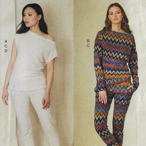 Puede incluir: Dos mujeres modelan conjuntos a juego. Uno es un top crema con hombros descubiertos y pantalones a juego. El otro es un conjunto de top y pantalón de manga larga con un colorido estampado de zigzag en tonos azules, naranjas y negros.