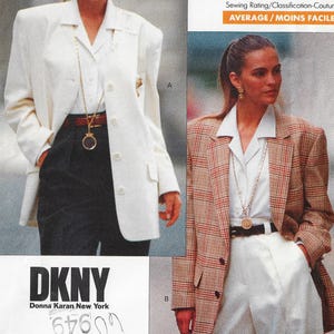 May include: Two women wearing blazers. One is wearing a white blazer with black pants, and the other is wearing a brown plaid blazer with white pants. The DKNY logo is visible at the bottom of the image.