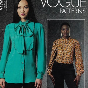 May include: Two women's blouses, one teal with a large bow and the other with a floral print. The pattern is Vogue Patterns V1789.