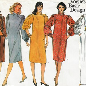 May include: Five different dress patterns with long sleeves and a high neck. The dresses are in various colors and patterns, including brown, blue, yellow, red, and white. The pattern is titled "Vogue's Basic Design".