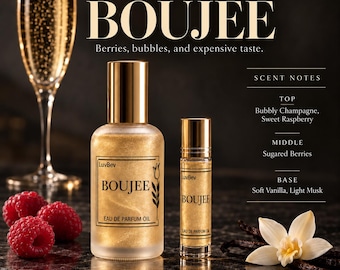 May include: Two bottles of LuvBev Fragrances BOUJEE Eau de Parfum Oil with gold shimmer liquid. The label features the text BOUJEE and a tulip icon. Beside the bottles are fresh raspberries, a champagne flute, and a vanilla flower.